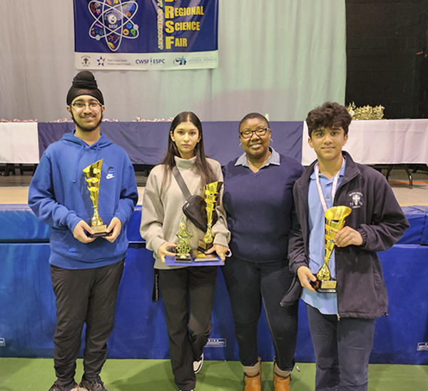 The 2023 Bison Regional Science Fair finalists along with Dr. Ifeoma Okwor representing Genome Prairie. From left to right, Baljot Rai, Annika Paliwal and Sneh Vyas. Bison Regional Science Fair award ceremony, Holy Cross High School, St. Boniface, Manitoba. April 20, 2023. 